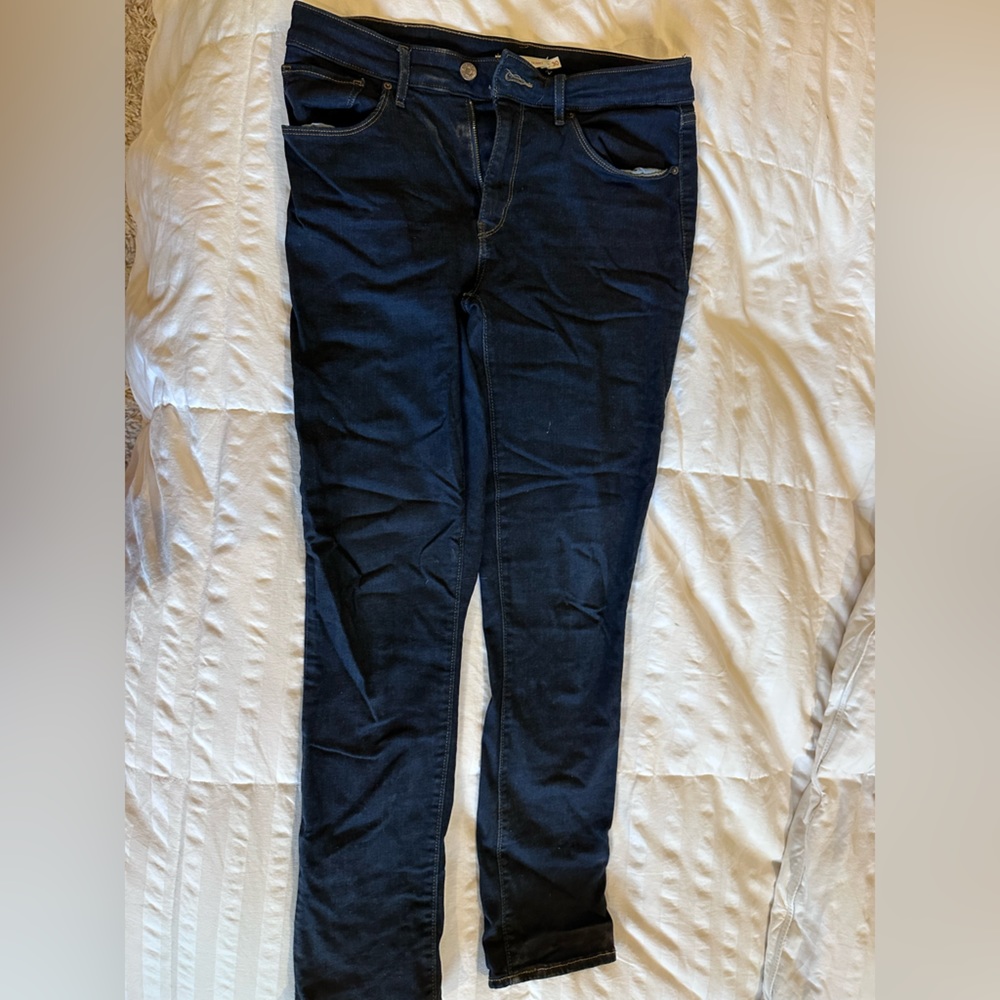 Levi’s- Classic Mid Rise Skinny, dark blue jeans. Size 30 in women’s.